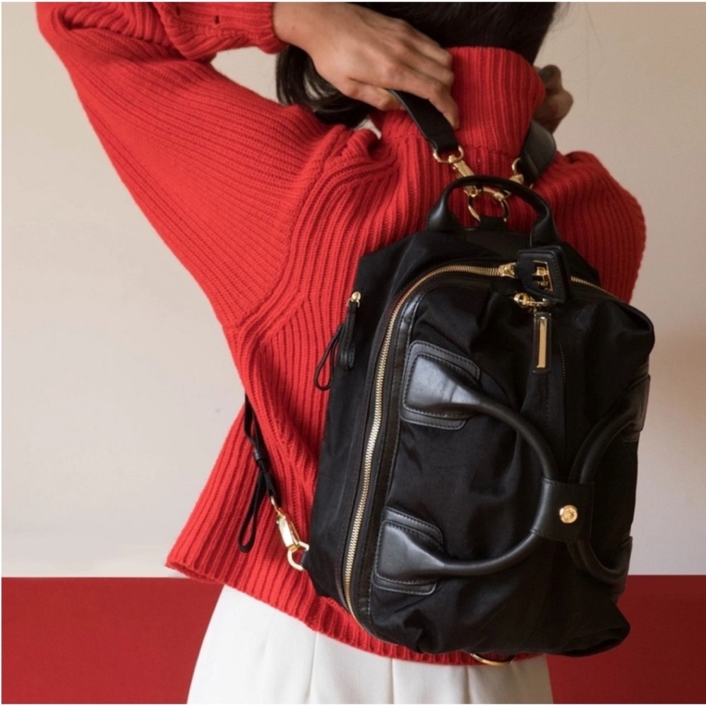 Blue Women's Convertible Backpack with Gold Accents